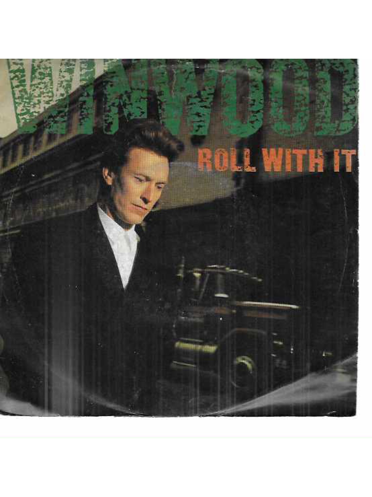 SINGLE / Steve Winwood – Roll With It